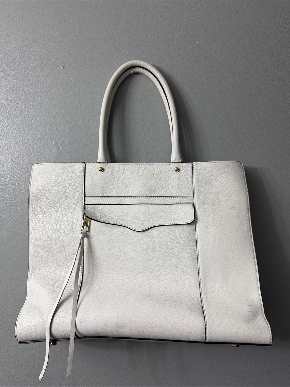 Rebecca Minkoff M.A.B. tote bag made of white textured leather.